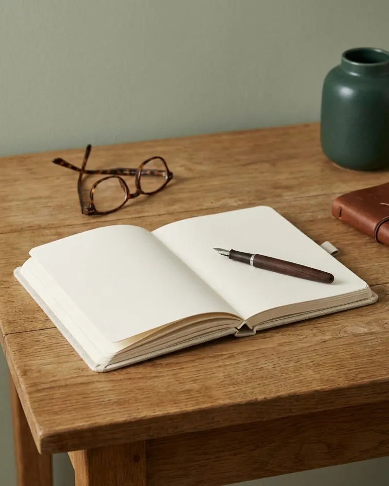 An open notebook and pen, ready to weigh up options